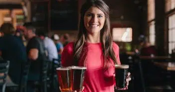 woman holding 3-piece cups